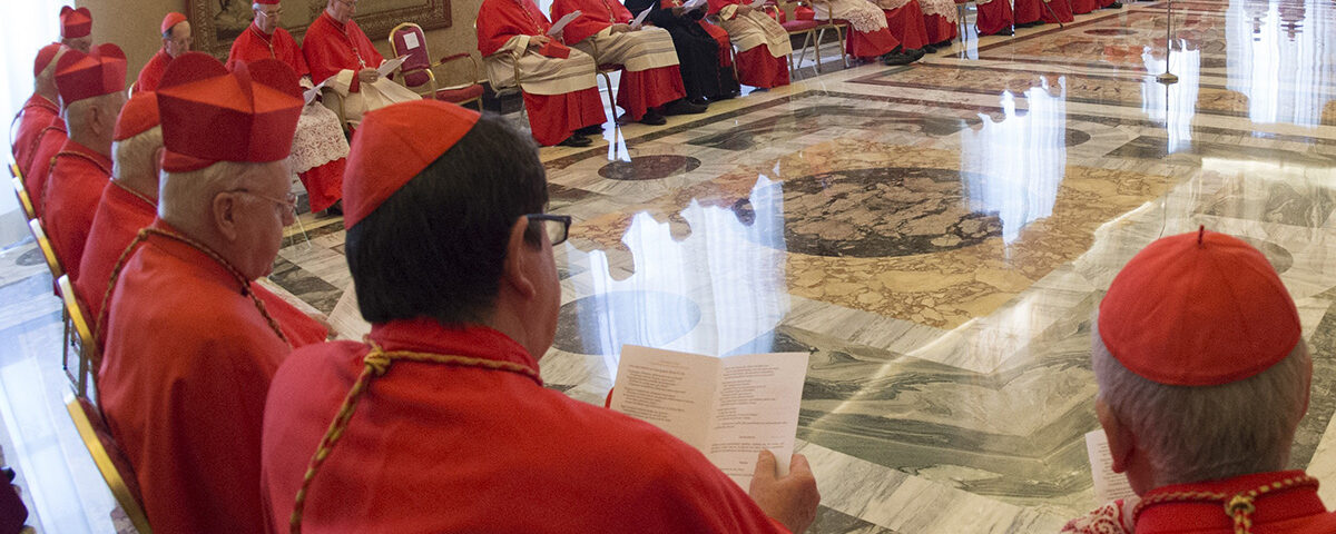 Pope Francis talks to a group of Cardinals during a Consistory at the Vatican Tuesday, March 15, 2016. Mother Teresa will be made a saint on Sept. 4. Pope Francis set the canonization date Tuesday, paving the way for the nun who cared for the poorest of the poor to become the centerpiece of his yearlong focus on the Catholic Church's merciful side. (L'Osservatore Romano/pool photo via AP)