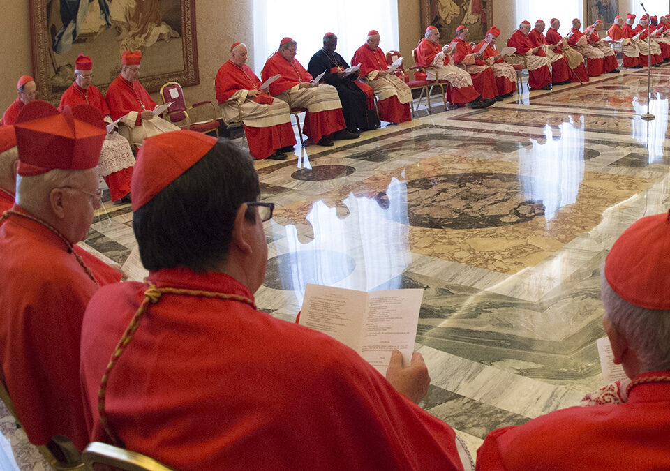 Pope Francis talks to a group of Cardinals during a Consistory at the Vatican Tuesday, March 15, 2016. Mother Teresa will be made a saint on Sept. 4. Pope Francis set the canonization date Tuesday, paving the way for the nun who cared for the poorest of the poor to become the centerpiece of his yearlong focus on the Catholic Church's merciful side. (L'Osservatore Romano/pool photo via AP)